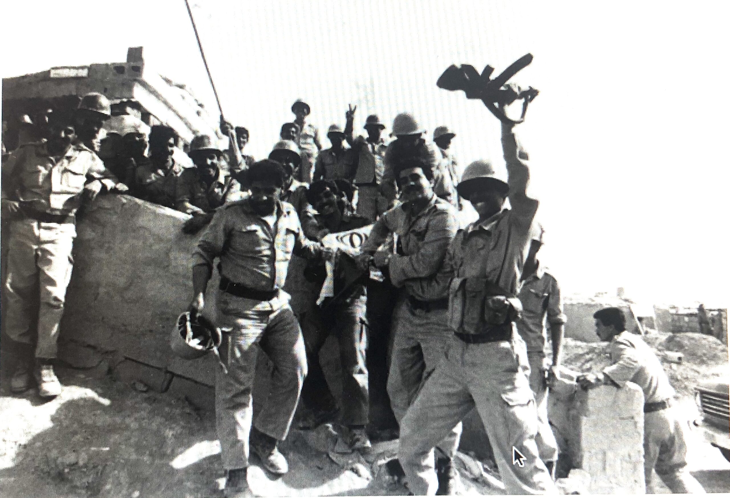 Iraqi soldiers celebrate after capturing Iranian cities